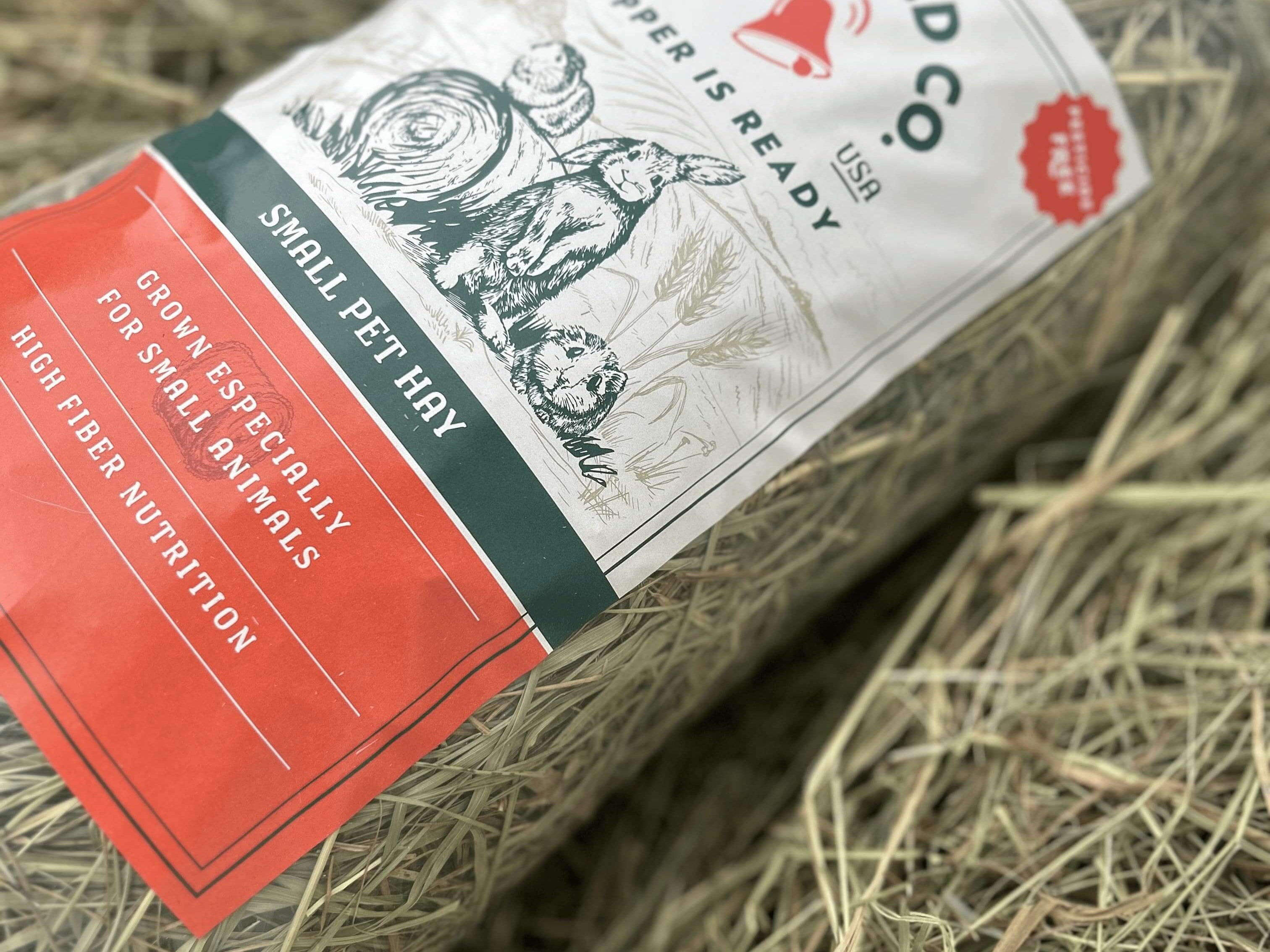 some guinea pig hay in a bag laying on its right side. 